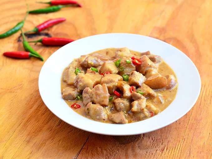 Bicol Express (Bikol: Sinilihan) is a popular Filipino dish which was popularized in the district of Malate, Manila but made in traditional Bicolano style.[1][2] It is a stew made from long chilies (siling mahaba in Tagalog, lada panjang in Malay/Indonesian), coconut milk, shrimp paste or stockfish, onion, pork, and garlic. It is said to have been inspired by the fiery Bicolano dish gulay na may lada, which is nowadays presented as one of the many variants of Bicol Express.Bicol Express was named after the passenger train service[3] from Manila to the Bicol region,[4] a region in the Philippinesfamous for its spicy cuisine.Source: https://en.wikipedia.org/wiki/Bicol_Express